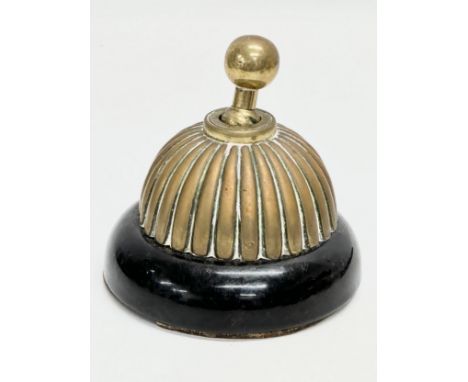 An Early 20th Century brass dolly light switch. Diswan. 12x12cm