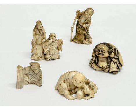 A collection of 19th Century Japanese carved bone netsuke figures.