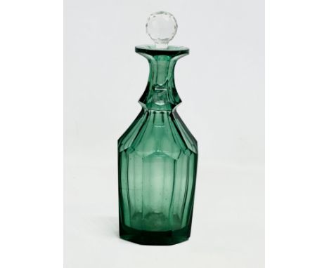 A 19th Century green slice cut decanter. 28cm