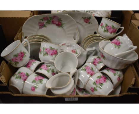 A Czechoslovakian part tea service decorated with pink roses (approx 42 pieces)