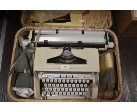 A vintage Hermes 3000 Typewriter in a suitcase, also included is a Singer Sewing hardback book.
In working condition, is not 
