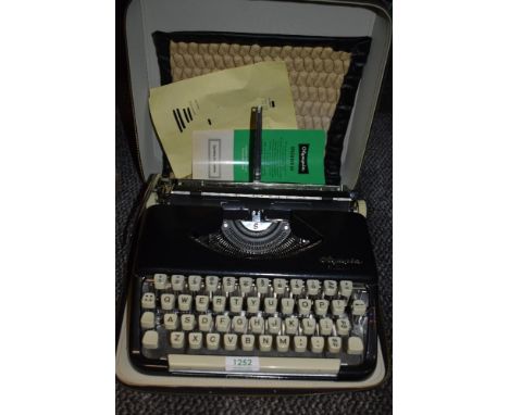 A cased Olympia Splendid 66 Typewriter.