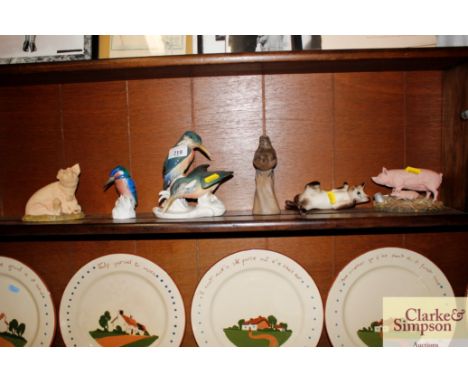 An Aynsley ornament in the form of a pig; a Kingfisher ornament ; and a Poole ornament in the form of a wren