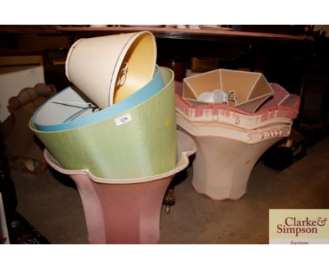 A quantity of various lamp shades