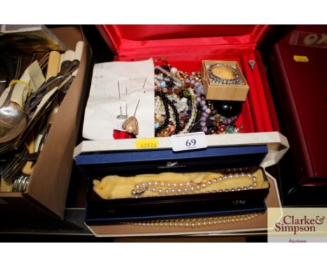 A jewellery box and contents of various costume jewellery; and a quantity of simulated pearl necklaces etc.