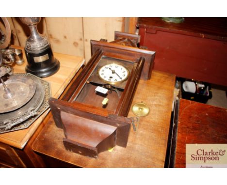 A mahogany cased single hole wall clock