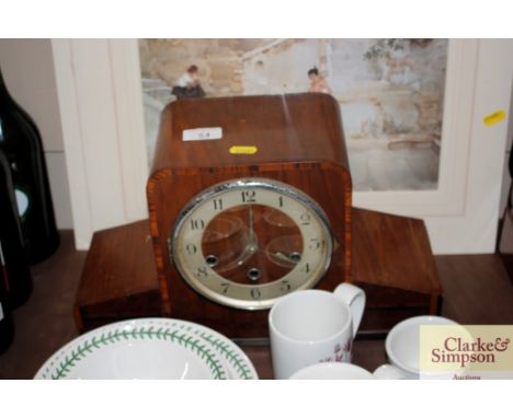 An Art Deco three hole mantel clock