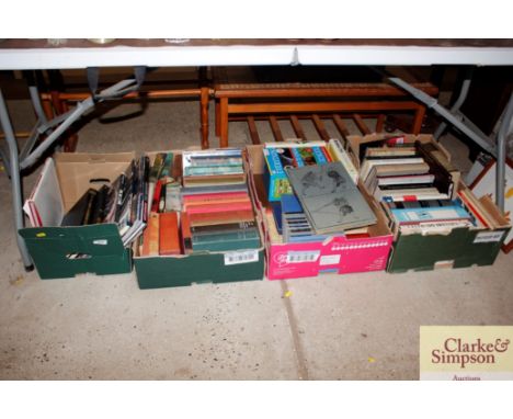 Four boxes of various books; to include Harley Davidson