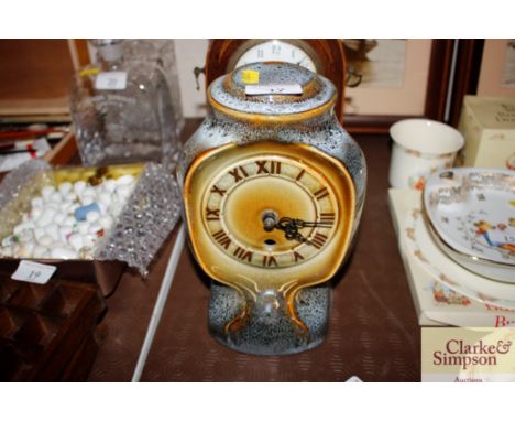 A glazed pottery mantel clock