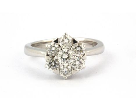 An 18ct white gold cluster ring set with brilliant cut diamonds, approx. 1ct, (K).