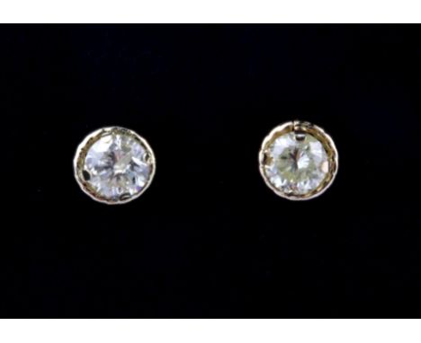 A boxed pair of 18ct yellow gold (stamped 750) stud earrings set with brilliant cut fancy light yellow diamonds, approx. 0.20