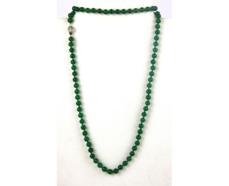 A single strand polished jade bead necklace, L. 76cm, bead 0.6cm.