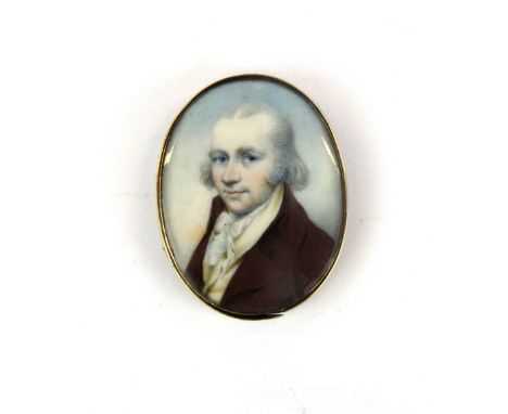 A Georgian yellow metal (tested gold) mounted hand painted portrait miniature of a gentleman with lock of hair on reverse, L.