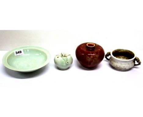 A Chinese celadon glazed bowl and water dropper with a red glazed porcelain vase and a white porcelain bowl, first item Dia. 