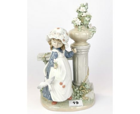 A Lladro porcelain figure of a girl, H. 27cm.