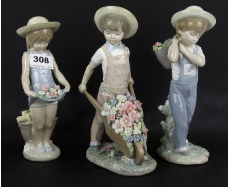 Three Lladro figures of children with flowers, H. 23cm.