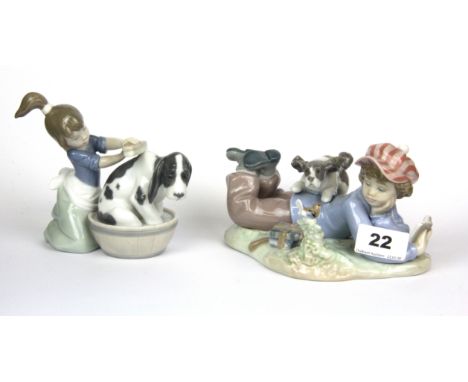 Two Lladro figures of children with puppies, tallest H. 13cm.