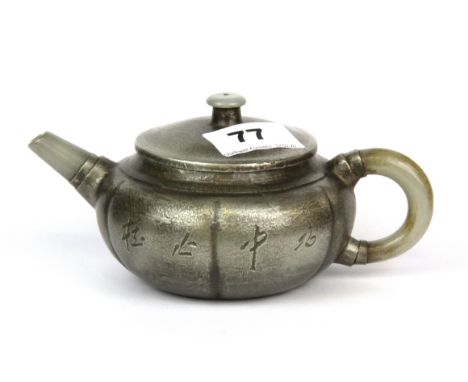 A Chinese pewter covered Yixing terracotta teapot with jade spout and handle, spout to handle 17cm.