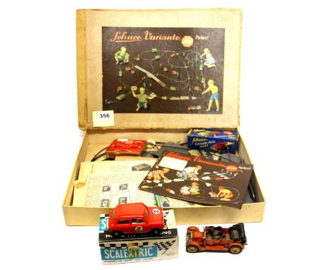A Schuco Varianto motor car layout and vehicle  together with a Scalextric motor car and a Corgi Daimlier 38.