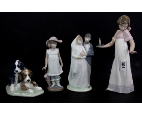 Four Nao figurines, tallest H. 26cm.