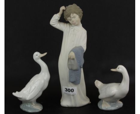 A Nao figure (matte finish) of a boy together with two gloss finish Nao geese, boy H. 26cm.