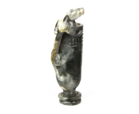 A rare Chinese carved grey and white jade wine cup with integral ring to foot and a dragon as a handle, H. 20.5cm.