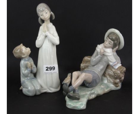 Two Lladro figures of children, tallest H. 21cm.