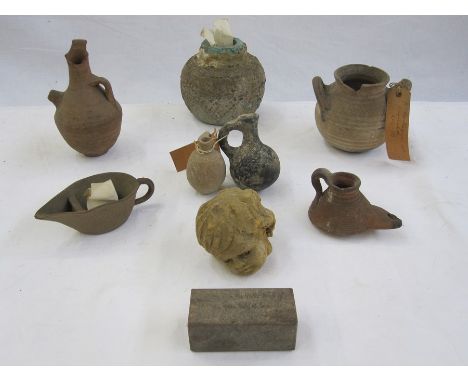 A quantity of ancient pottery vessels, first Millennium BC, some with tickets attached These items are from the collection of