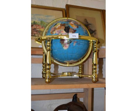 A globe on gilt metal stand