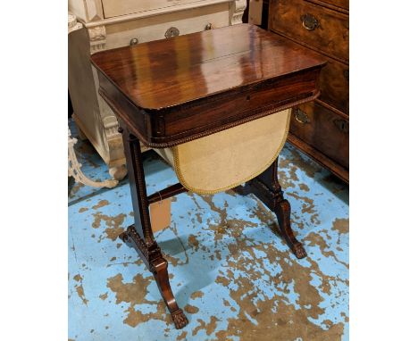 WORK TABLE, early 19th century George IV rosewood, finished off with bobbin turned beading raised on stile support, united by