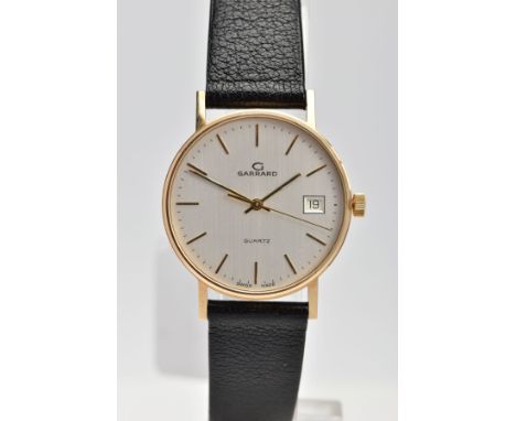 A GENTLEMENS 9CT GOLD 'GARRARD' WRISTWATCH, quartz movement, round silver dial signed 'Garrard, Quartz', baton markers, date 