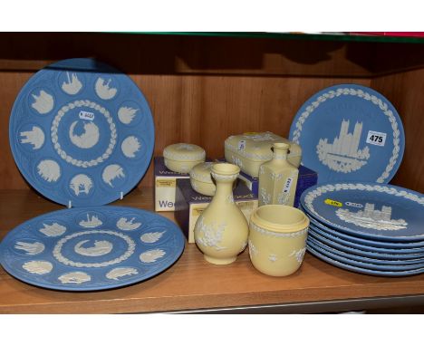 A COLLECTION OF BOXED WEDGWOOD JASPERWARE IN PALE BLUE ANF PRIMROSE YELLOW, comprising eight Christmas plates, five x 1977, 1