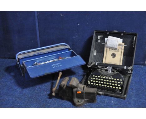 A VINTAGE HANDY MODEL G.2 BENCH VICE with a metal toolbox containing a handful of spanners and a vintage Corona typewriter (3
