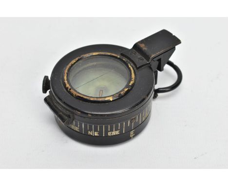 A MILITARY COMPASS, black compass, stamped T.G.C2 Ltd London number 234303, dated 1943 MK III