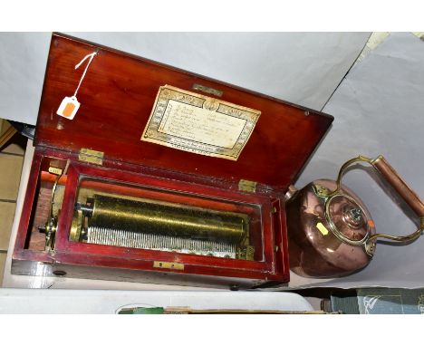 A LATE 19TH CENTURY SWISS WALNUT AND WALNUT STAINED CYLINDER MUSIC BOX, plain exterior, hinged top opening to reveal a printe