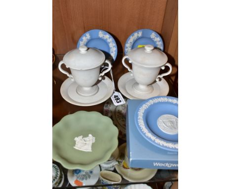 A PAIR OF 19TH CENTURY WEDGWOOD WHITE BISQUE TWIN HANDLED LEMONADECUPS, COVERS AND STANDS AND FOUR PIECES OF 20TH CENTURY WED