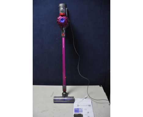 A DYSON TS1-UK-JEC1700A cordless vacuum with charger and instruction manual (PAT pass and working)