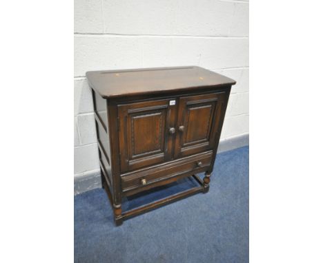 AN ERCOL TWO DOOR CABINET, with a single drawer, width 79cm x depth 44cm x height 88cm