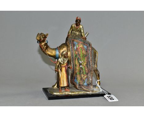 AN AUSTRIAN COLD PAINTED SPELTER NOVELTY TABLE LIGHTER IN THE STYLE OF BERGMAN, cast as two figures with a camel, mounted on 