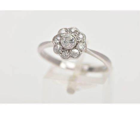A DIAMOND CLUSTER RING, white metal flower shape cluster set with nine old cut diamonds, estimated total diamond weight 0.50c