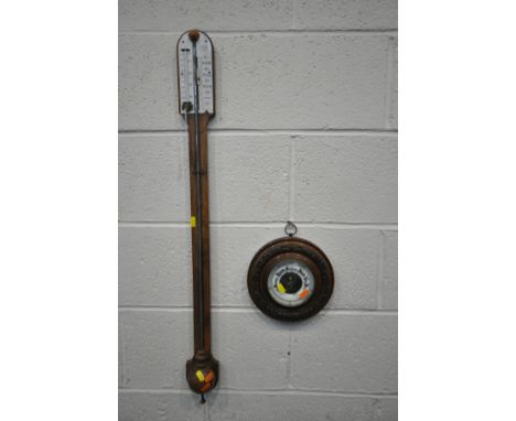 A ROSEWOOD CISTERN STICK BAROMETER, signed Negretti &amp; Zambra of London, height 92cm (condition:-chip to marking plate) an