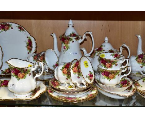 A COLLECTION OF ROYAL ALBERT OLD COUNTRY ROSES TEA AND COFFEE WARES, comprising a tea pot and cover, height 16cm, two coffee 