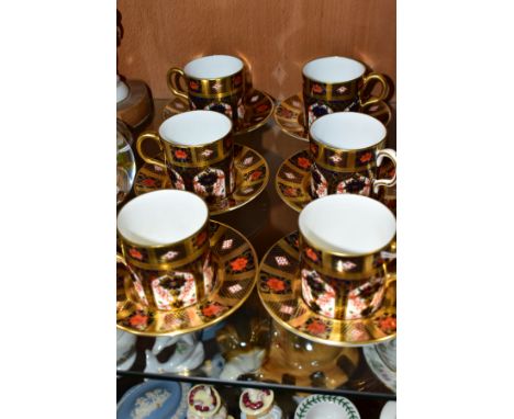 A SET OF SIX ROYAL CROWN DERBY SOLID GOLD BAND IMARI COFFEE CANS AND SAUCERS IN THE 1128 PATTERN, all first quality, date cyp