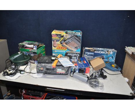 A WORKZONE RECIPRICAL SAW with box, a Home Protector security camera system, a Plasplugs Compact Plus tile cutter and a Parks