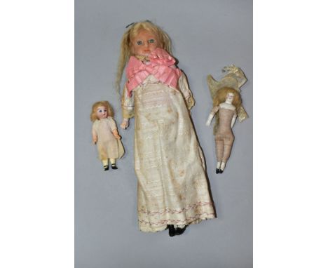 A LATE NINETEENTH CENTURY WAX HEAD DOLL WITH TWO SMALL BISQUE HEAD DOLLS, comprising larger, possibly German?, doll with blue