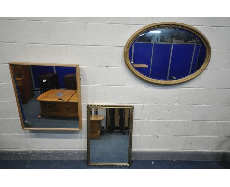 A HALO LIVING LIGHT OAK FRAMED WALL MIRROR, 80cm x 70cm, along with a giltwood bevelled edge oval wall mirror, and another mi