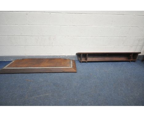 AN OAK FENDER, with loose parquetry flooring, inner length 133cm x depth 33cm and a oak wall shelf, using timbers from a buil