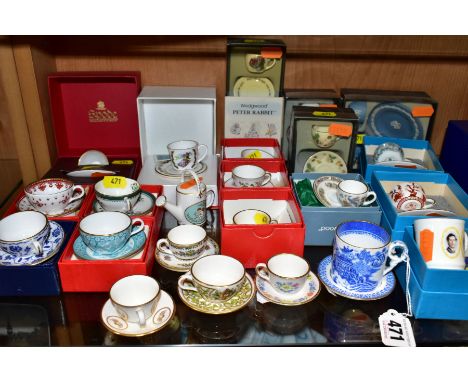 A COLLECTION OF BOXED AND LOOSE MINIATURE TEA CUPS, SAUCERS, MUGS, WATERING CAN, ETC, mostly Wedgwood, Spode, Coalport, Royal