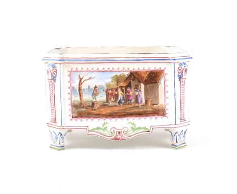 An 18th century Veuve Perrin rectangular jardiniere on raised corner feet, the side panels decoratad with village scenes of d