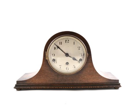 An oak cased Napoleon style mantel clock, arabic dial, three train movement, Westminster chime. 44cm wide.
